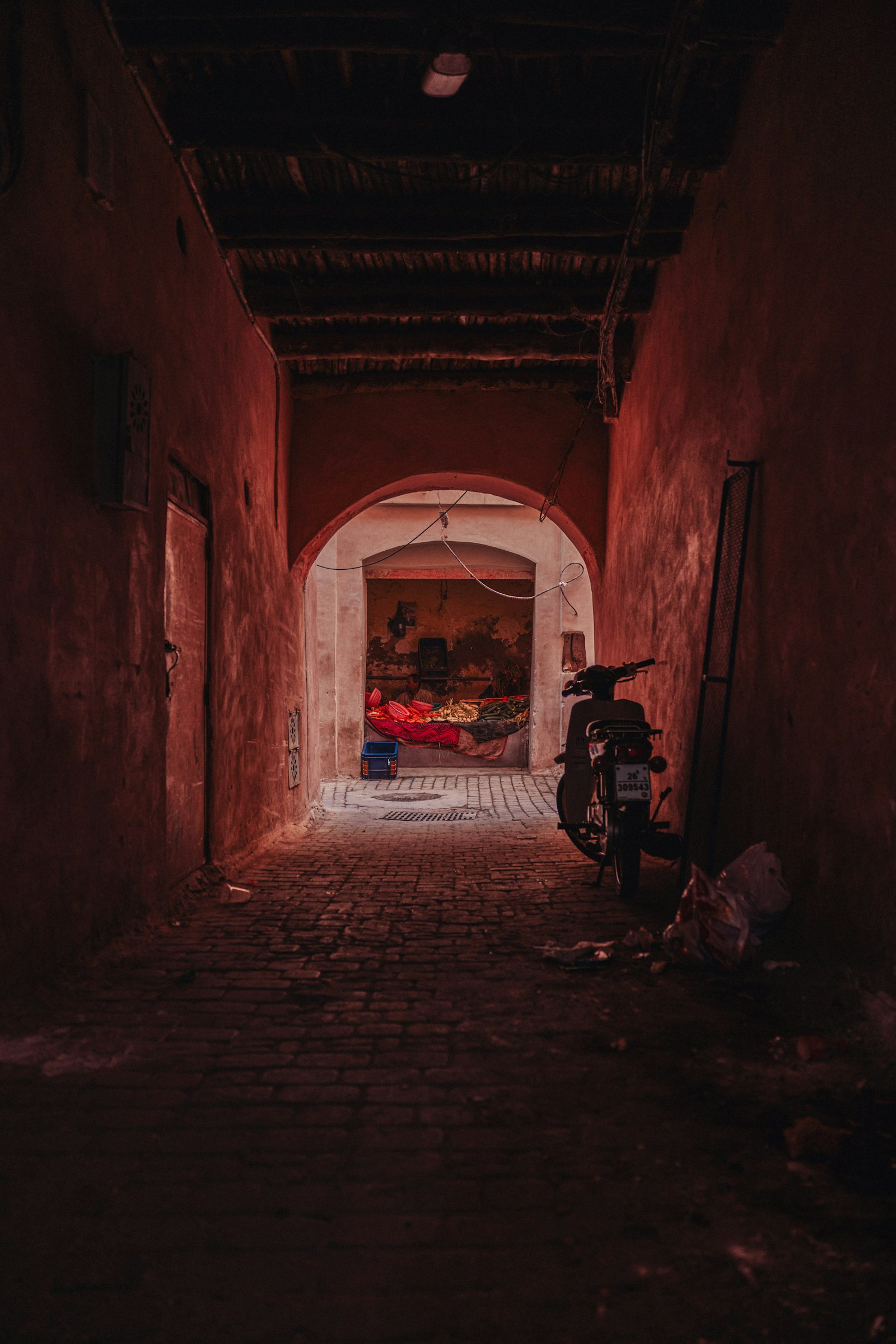 Lantern-lit alley in a Moroccan medina at dusk