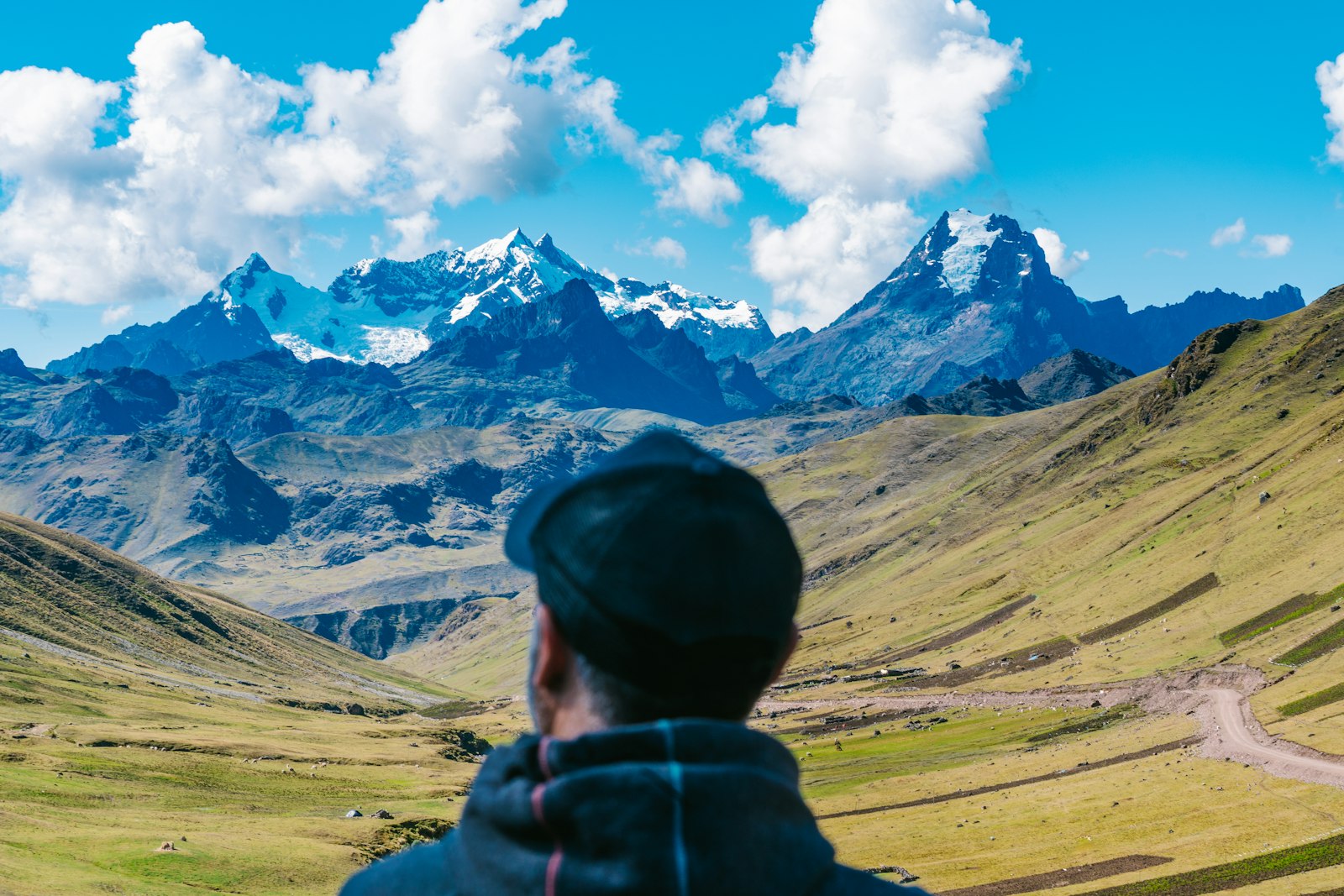 Terraced green slopes in the Peruvian Andes under morning cloud